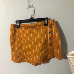 Orange striped skirt/shorts.